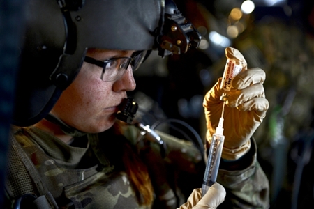 Army Medic fills a syringe