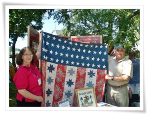 Jane and Guy holding Stars and Bars Forever